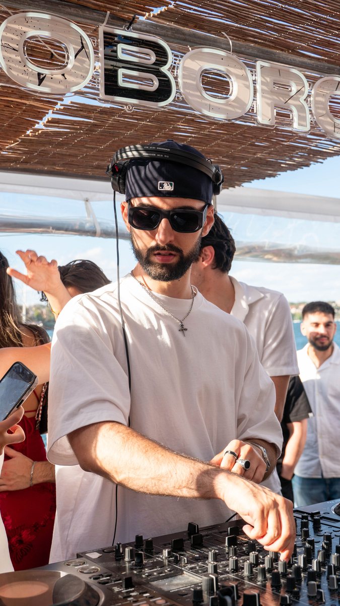 DJ in the booth at The Island, peak-time house set